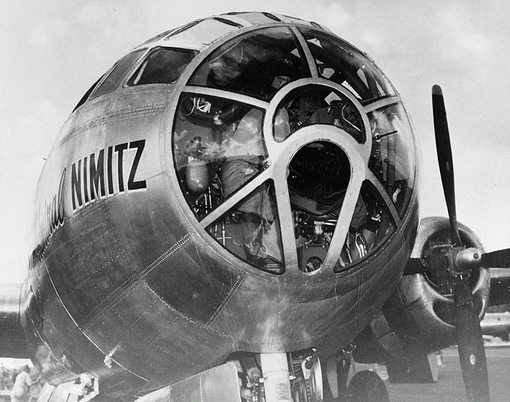 A closeup view of the nose of the B-29 Superfortress named "Fleet Admiral Nimitz" after its landing at Guam, 1945.