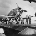 Sailors mount a 1000-pound bomb beneath a Douglas SBD-3 Dauntless on the flight deck of USS Ranger during Operation Torch in November 1942. (U.S. National Archives Photograph.)