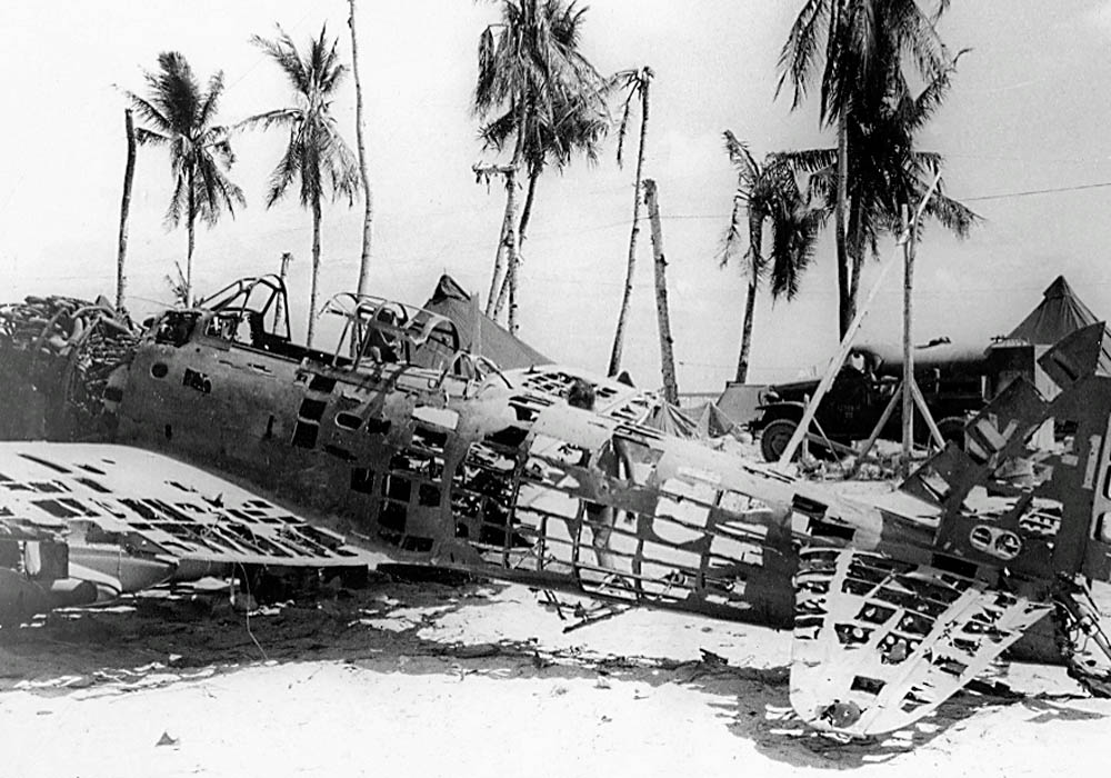 The remains of a wrecked Japanese Aichi D3A Val dive bomber in the Gilbert Islands, 1943.