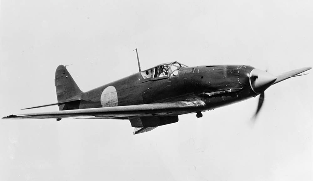 The U.S. Navy evaluates a captured Japanese Kawasaki Ki-61 fighter at the U.S. Navy Naval Air Test Center Patuxent River, Maryland in June 1945. (Official U.S. Navy Photograph.)