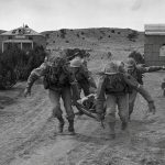 U.S. Army Medical Corps soldiers train at Camp Carson, Colorado, April 1943. (U.S. National Archives and Records Admin. Photograph.)