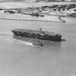 Aerial photograph of the escort carrier USS Card (ACV-11) in Hampton Roads, Virginia. (U.S. Navy Photograph.)