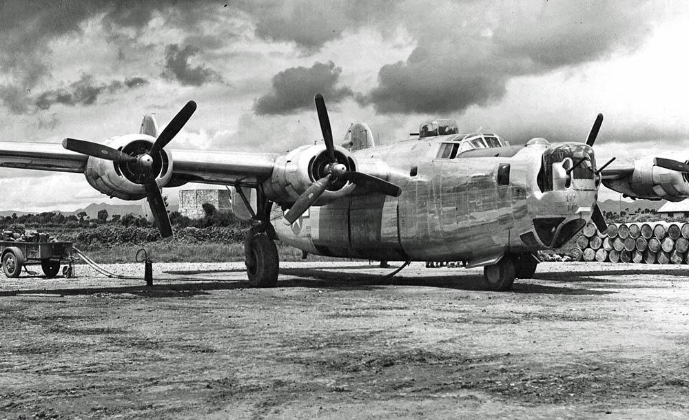 A B-24J Liberator unloads fuel after flying "The Hump" into Kunming, China in September 1944. (U.S. Air Force Photograph.)