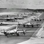 Boeing B-29 Superfortress bombers of the 462nd Bomb Group line up on West Field, Tinian Island in the Mariana Islands, 1945. (U.S. Air Force Photograph.)