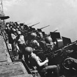 Sailors man 20mm Oerlikon antiaircraft guns on the catwalk of the aircraft carrier USS Hornet (CV-12) in February 1945. (U.S. National Archives and Records Admin. Photo.)