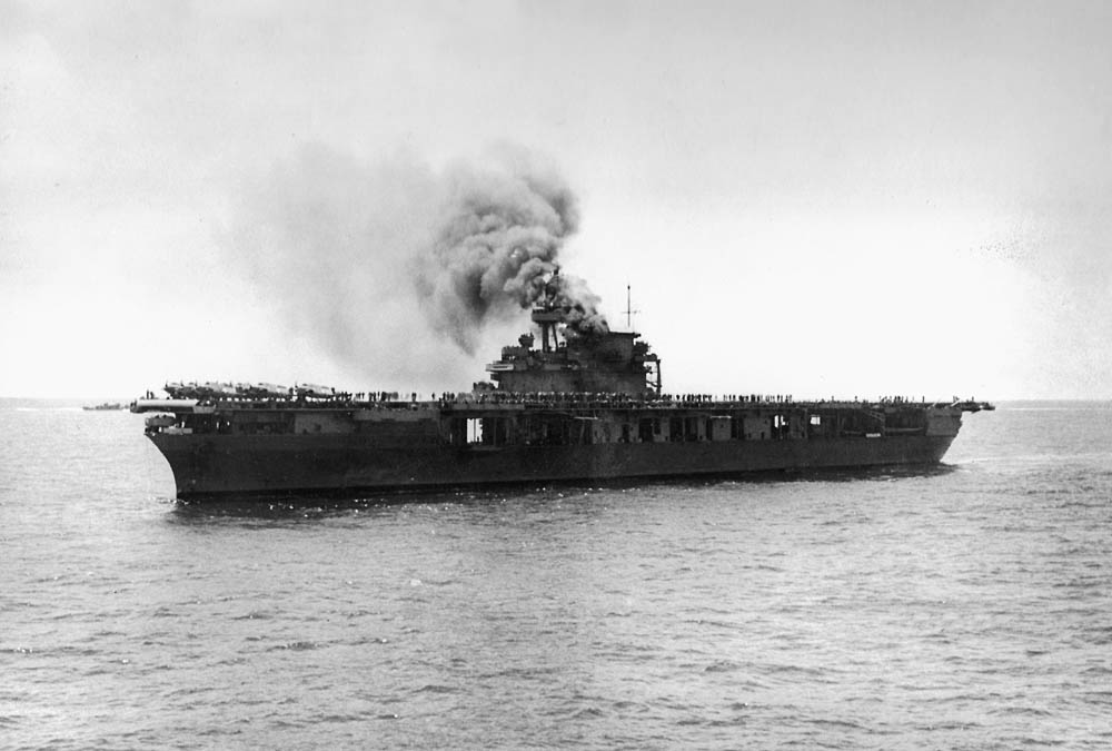 The U.S. Navy aircraft carrier USS Yorktown (CV-5) burns on June 4, 1942 after attacks from Japanese dive bombers during the Battle of Midway. (Official U.S. Navy Photograph.)