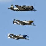 A P-47 Thunderbolt and two P-51 Mustangs fly in formation during 2015 Heritage Flight training at Davis-Monthan Air Force Base, Arizona, Feb. 28, 2015. (U.S. Air Force Photo by Airman 1st Class Chris Massey / Released.)