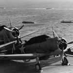 Landing craft maneuver behind the aircraft carrier USS Enterprise in July 1942 during the Guadalcanal-Tulagi Operation. (Official U.S. Navy Photograph via U.S. National Archives.)