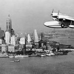 A U.S. Coast Guard Grumman J4F Widgeon amphibious aircraft flies on patrol over New York City in 1939. (U.S. Coast Guard Photograph.)