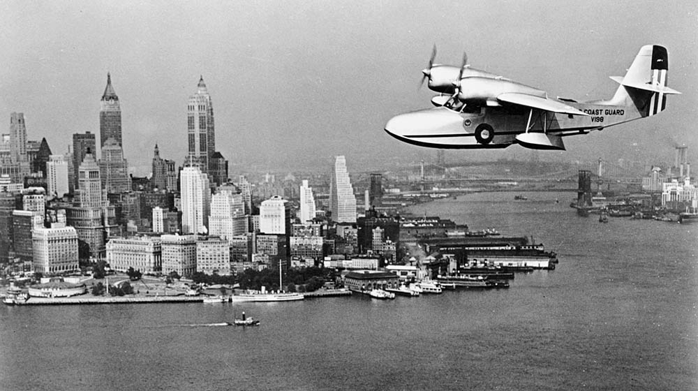 A U.S. Coast Guard Grumman J4F Widgeon amphibious aircraft flies on patrol over New York City in 1939. (U.S. Coast Guard Photograph.)