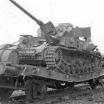 A Panzer IV on a railcar destroyed by Allied air attack near Dasburg, Germany. (U.S. Air Force Photograph.)