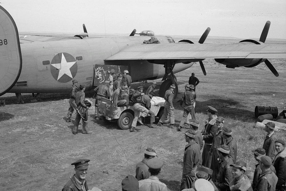 B-24 Liberator crews from the U.S. 9th Air Force receive a briefing from Major Frank W. Delong, squadron commander, before a mission over Axis territory. (Library of Congress Photograph.)