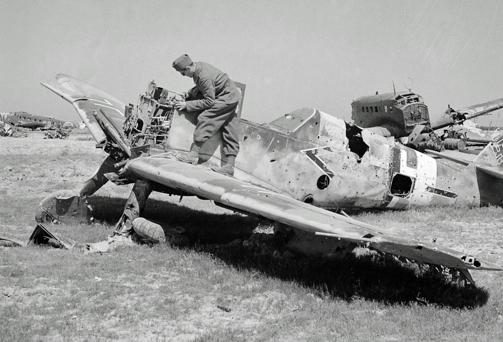 In Tunisia, a French soldier inspects German Luftwaffe wreckage including an Me 109 fighter in the foreground. (Office of War Information Photograph Collection, Library of Congress.)