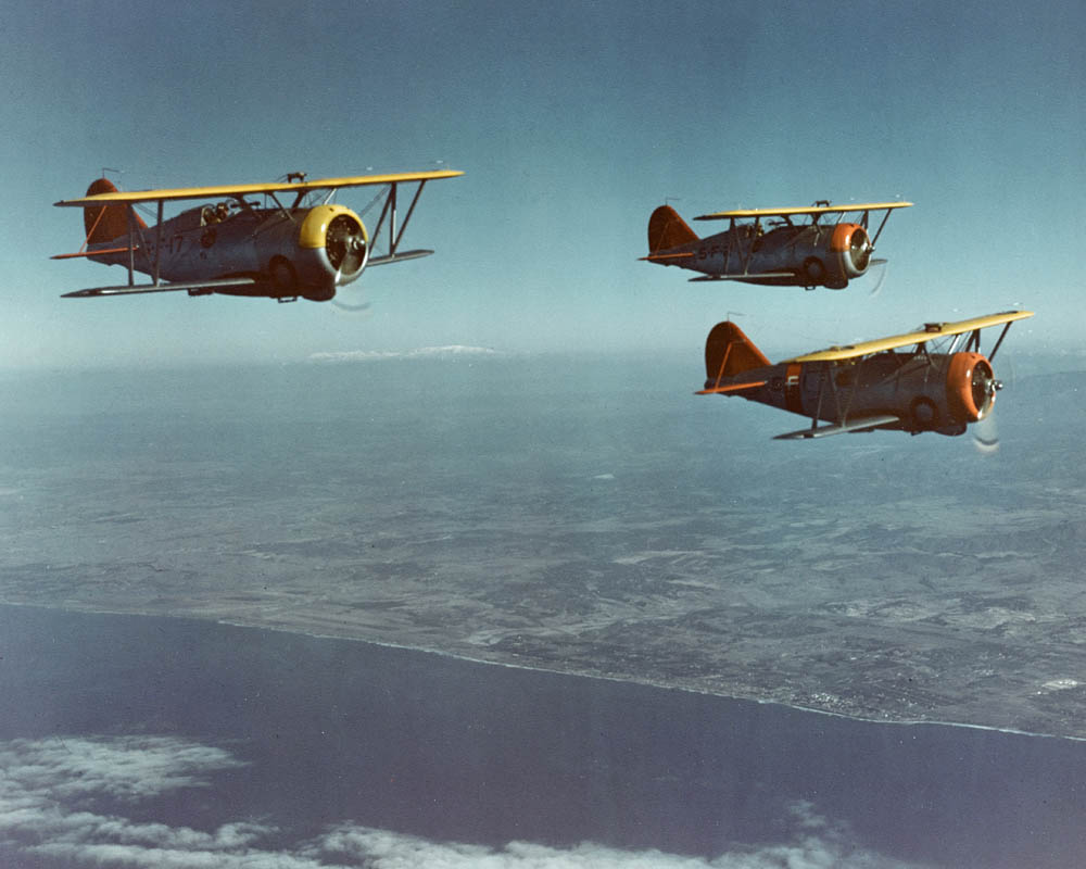 Three Grumman F3F-3 fighters from U.S. Navy Fighting Squadron 5 (VF-5) from the aircraft carrier USS Yorktown (CV-5) fly over southern California in 1939. (Official U.S. Navy Photograph.)