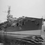 The Royal Navy escort carrier HMS Arbiter (D31) moored at Greenock, Scotland in July 1944. (Imperial War Museums Collection.)