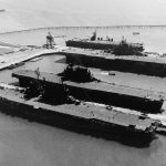 After the end of WWII, the four U.S. Navy aircraft carriers USS Saratoga (CV-3), USS Enterprise (CV-6), USS Hornet (CV-12) and USS San Jacinto (CVL-30), from foreground to background, docked at Naval Air Station Alameda, California in September 1945. (U.S. Navy Photograph.)