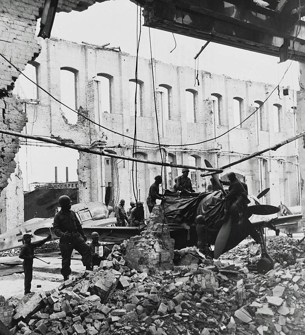 American soldiers from the 4046th QM Truck Company search captured Luftwaffe Fw 190 fighters for souvenirs to send home. (U.S. Library of Congress Prints and Photographs.)