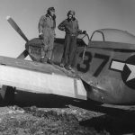 Photographer Toni Frissell stands on the wing of a P-51 Mustang with Major George S. Roberts at Ramitelli, Italy in March 1945. (Library of Congress Photograph.)