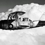 A U.S. Navy Curtiss SBC-3 Helldiver biplane from Scouting Squadron Three (VS-3), assigned to the aircraft carrier USS Saratoga (CV-3), flies over San Diego, California. (U.S. Navy Photograph)