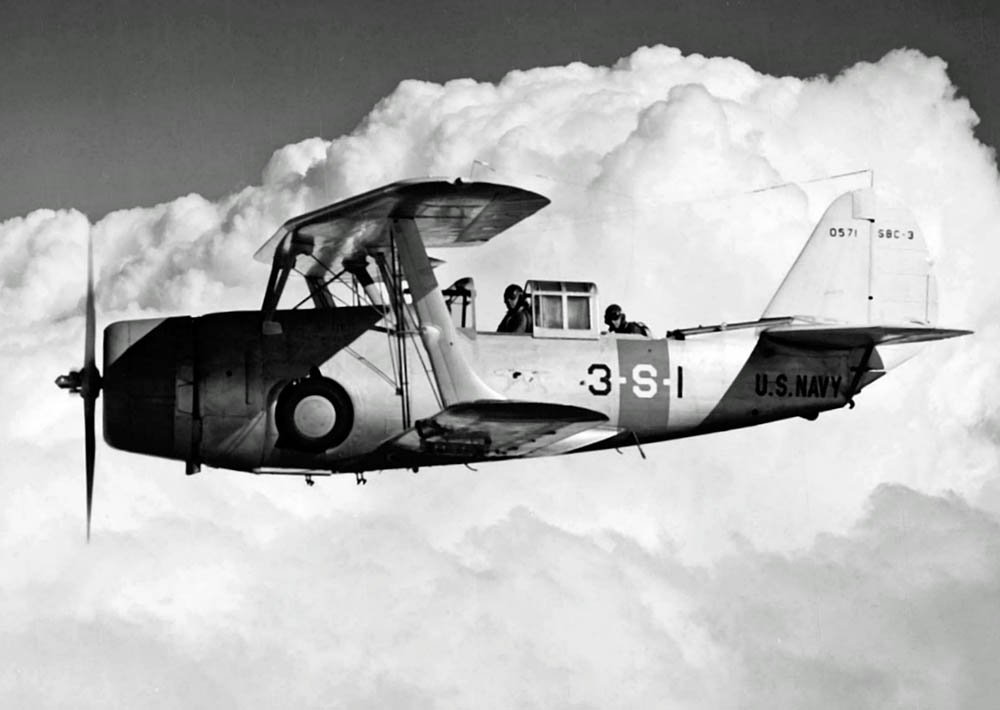 A U.S. Navy Curtiss SBC-3 Helldiver biplane from Scouting Squadron Three (VS-3), assigned to the aircraft carrier USS Saratoga (CV-3), flies over San Diego, California. (U.S. Navy Photograph)