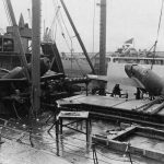 Original Caption: View of the deck of a ship upon arrival at Glasgow, Scotland after heavy seas washed one plane overboard and forced two others from their lashings causing considerable damage. The planes were being transported from the United States for use in the ETO. 23 January 1944. (U.S. Air Force Photograph.)