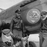 Pilots from the 85th "Flying Skull" Fighter Squadron, 79th Fighter Group discuss air tactics in front of a Curtiss P-40 Warhawk fighter. (U.S. Air Force Photograph.)