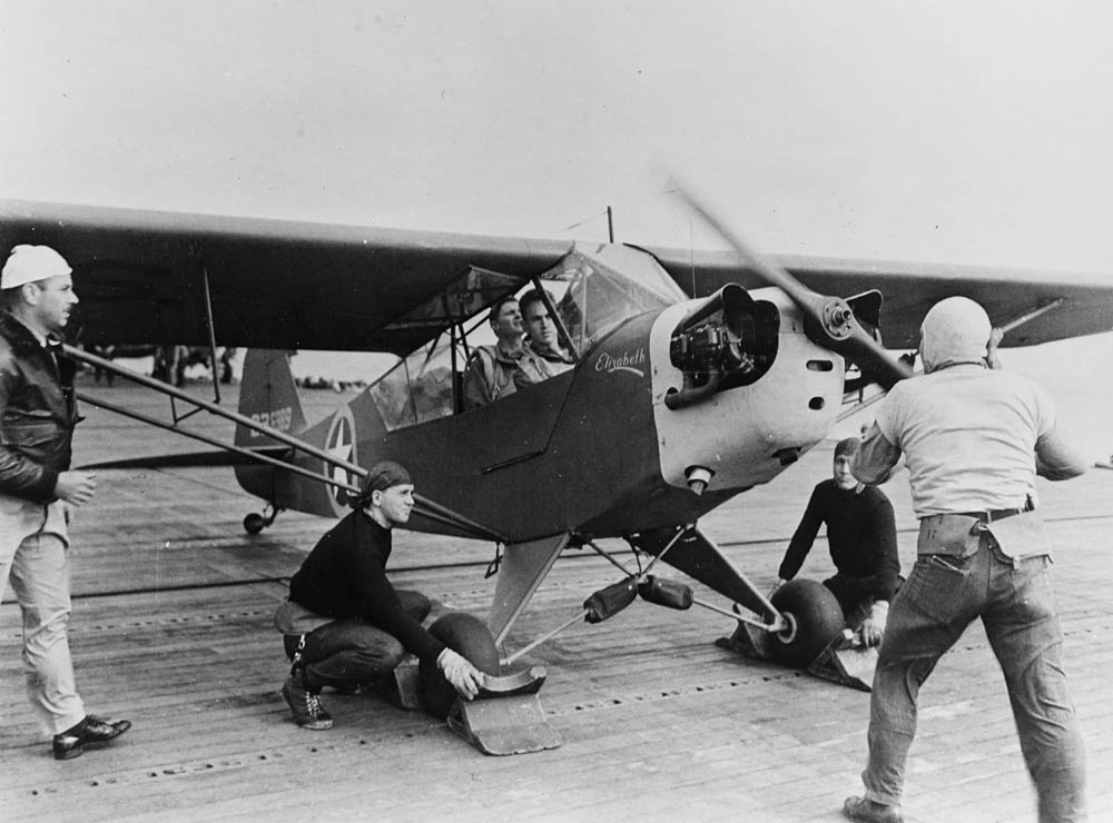 A Piper L-4 Grasshopper liaison aircraft, nicknamed Elizabeth, prepares to takeoff from the USS Ranger (CV-4) during Operation Torch in November 1942. (U.S. Navy Photograph.)