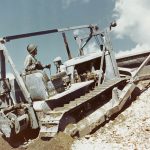 A Seabee Caterpillar D7 medium bulldozer goes to work at the Construction Battalion Training Center, Camp Endicott, Davisville, Rhode Island, in the fall of 1943. (U.S. Navy Photograph.)