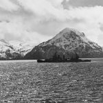 The New Orleans-class cruiser USS San Francisco (CA-38) passes in front of mountains in Kulak Bay, Adak, Aleutian Islands in April 1943. (Official U.S. Navy Photograph, National Archives.)