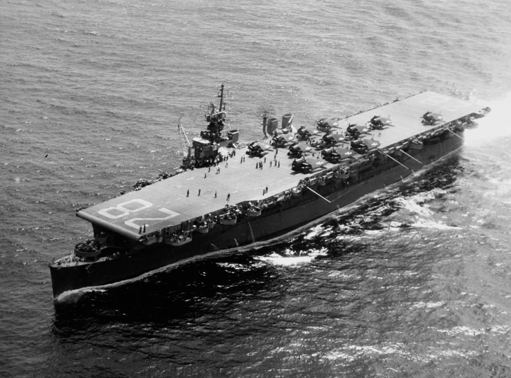 The Independence-class light aircraft carrier USS Cabot (CVL-28) departs Pearl Harbor with the aircraft of Carrier Air Group 32 (CVG-32) on board, en route to Eniwetok. (Official U.S. Navy Photograph.)