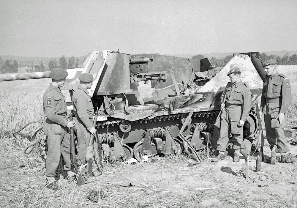 British soldiers from the 6th Airborne Division are photographed with a wreck of a Marder I (Sd.Kfz. 135) tank destroyer, built on the Hotchkiss H35 chassis, in Normandy, August 1944. (Imperial War Museum Photograph.)